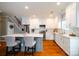 Modern kitchen with white cabinets, stainless steel appliances, and a large island at 8621 Sequoia Grove Ln, Charlotte, NC 28214