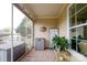 Covered patio featuring a brick floor, natural light and view of the landscaped yard at 8621 Sequoia Grove Ln, Charlotte, NC 28214