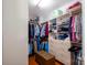 Spacious walk-in closet with custom shelving and wood floors at 8621 Sequoia Grove Ln, Charlotte, NC 28214