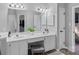 Elegant bathroom with double sinks, white cabinets, vanity, and a decorative rug at 9118 Pine Springs Ct, Huntersville, NC 28078