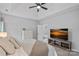 Relaxing bedroom featuring a vaulted ceiling, neutral colors, and a view to the exterior at 9118 Pine Springs Ct, Huntersville, NC 28078