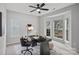 Cozy home office with a ceiling fan, desk, and a large window to enjoy natural light at 9118 Pine Springs Ct, Huntersville, NC 28078