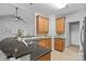 Modern kitchen featuring wood cabinets, granite counters, tile backsplash, and stainless faucet at 9118 Pine Springs Ct, Huntersville, NC 28078