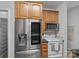 This kitchen features stainless steel appliances, wood cabinetry, and modern design at 9118 Pine Springs Ct, Huntersville, NC 28078