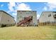 Spacious backyard with patio and stairs to upper level at 10161 Castlebrooke Dr, Concord, NC 28027