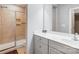 Bathroom featuring tiled shower, white vanity, and tile flooring at 10161 Castlebrooke Dr, Concord, NC 28027
