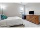Bedroom with neutral walls, plush carpet, wooden dresser, and a double bed at 10161 Castlebrooke Dr, Concord, NC 28027