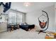 Bright ' bedroom with hanging chair, a playful design, and a dedicated desk area at 10161 Castlebrooke Dr, Concord, NC 28027