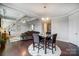 This eat in dining area is open to the living room and features hardwood floors at 10161 Castlebrooke Dr, Concord, NC 28027