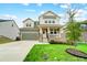 Charming two-story home with a well-manicured lawn, two-car garage, and inviting front porch at 10161 Castlebrooke Dr, Concord, NC 28027