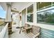 Inviting front porch with a cozy seating area, perfect for relaxing and enjoying the neighborhood views at 10161 Castlebrooke Dr, Concord, NC 28027