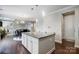 Stylish kitchen island with dark wood floors and an open layout to the dining area at 10161 Castlebrooke Dr, Concord, NC 28027