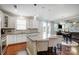 Modern eat-in kitchen features an island with bar seating, stainless appliances, and granite countertops at 10161 Castlebrooke Dr, Concord, NC 28027