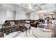 Open concept living room featuring coffered ceilings and a modern kitchen in the background at 10161 Castlebrooke Dr, Concord, NC 28027