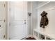 Organized mudroom area with coat hooks, bench seating, and shoe storage for convenience at 10161 Castlebrooke Dr, Concord, NC 28027