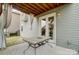 Back patio with neutral siding and a table at 10161 Castlebrooke Dr, Concord, NC 28027