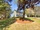 Traditional two-story home with a well-maintained lawn and a two car garage at 1090 Briarcliff Rd, Mooresville, NC 28115