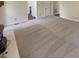 Spacious living room with plush carpet, neutral walls, and ample natural light at 1090 Briarcliff Rd, Mooresville, NC 28115