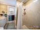 Modern bathroom featuring a glass-enclosed shower and neutral color palette, creating a spa-like experience at 11 Tallassee St, Badin, NC 28009