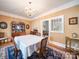 Elegant dining room with a chandelier and dark hardwood floors perfect for sophisticated gatherings at 11 Tallassee St, Badin, NC 28009