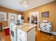 Cozy kitchen with a unique island, appliances, and hardwood floors, creating a warm atmosphere at 11 Tallassee St, Badin, NC 28009