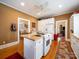 Functional kitchen with island, white cabinetry, and ample counter space at 11 Tallassee St, Badin, NC 28009