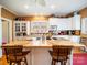 Functional kitchen with island, white cabinetry, and ample counter space at 11 Tallassee St, Badin, NC 28009
