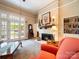 Cozy living room with fireplace, built-in bookshelves, and abundant natural light at 11 Tallassee St, Badin, NC 28009
