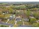 An aerial view showcases homes and lush greenery in this quiet residential neighborhood at 121 Tanglewood Dr, Kannapolis, NC 28081