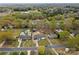 An aerial view shows the home nestled in a verdant neighborhood filled with mature trees at 121 Tanglewood Dr, Kannapolis, NC 28081