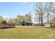 Large backyard featuring a detached garage/workshop and a wooden deck at 121 Tanglewood Dr, Kannapolis, NC 28081