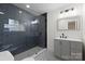 Modern bathroom with gray subway tile shower, decorative tile floor, and stylish vanity at 121 Tanglewood Dr, Kannapolis, NC 28081
