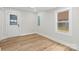 Bright, airy bedroom features wood-look floors and large windows for ample natural light at 121 Tanglewood Dr, Kannapolis, NC 28081