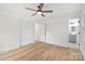 Bright bedroom features a ceiling fan, closet and an ensuite bath at 121 Tanglewood Dr, Kannapolis, NC 28081