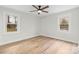 Bright bedroom with two windows, modern floors, and minimalist design at 121 Tanglewood Dr, Kannapolis, NC 28081