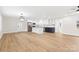 Open layout shows the island kitchen with stainless appliances and a view to the front door at 121 Tanglewood Dr, Kannapolis, NC 28081