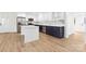 Modern kitchen with white cabinets, marble countertops, and stainless steel appliances at 121 Tanglewood Dr, Kannapolis, NC 28081