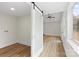 A conveniently located laundry room features a sliding door and window views at 121 Tanglewood Dr, Kannapolis, NC 28081