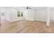 Bright living room features a modern ceiling fan and lovely light wood-look floors at 121 Tanglewood Dr, Kannapolis, NC 28081