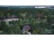 Breathtaking aerial view of an estate home backing to a golf course and lush mature trees at 138 Great Point Dr, Mooresville, NC 28117