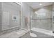 Well-lit bathroom featuring a shower-tub combo with decorative tile and a vanity with granite countertops at 138 Great Point Dr, Mooresville, NC 28117