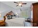 Comfortable bedroom with decorative pillows, carpet, a ceiling fan, and natural light from the window at 138 Great Point Dr, Mooresville, NC 28117