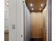 Residential elevator featuring wooden interior, lights, metal accents, and control panel at 138 Great Point Dr, Mooresville, NC 28117