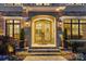 Inviting front entrance featuring a decorative glass double door, stone accents, and manicured landscaping at 138 Great Point Dr, Mooresville, NC 28117