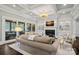 Well-lit living room features a fireplace, built-in shelves, and ample seating at 138 Great Point Dr, Mooresville, NC 28117
