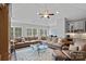 Open living room featuring a vaulted ceiling, many windows, carpet, and comfortable seating at 138 Great Point Dr, Mooresville, NC 28117