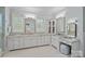 Bright main bathroom featuring dual vanities, lots of storage, and large mirrors at 138 Great Point Dr, Mooresville, NC 28117