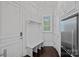 Mudroom features a bench with hooks and a closet for storage, plus easy access to the garage at 138 Great Point Dr, Mooresville, NC 28117