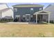 Spacious backyard boasts a covered patio, ample lawn space, and privacy fencing at 15126 Shallow Ridge Rd, Charlotte, NC 28278