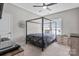 A bedroom with neutral walls and carpet, ceiling fan, and modern furnishings, with natural light at 15126 Shallow Ridge Rd, Charlotte, NC 28278